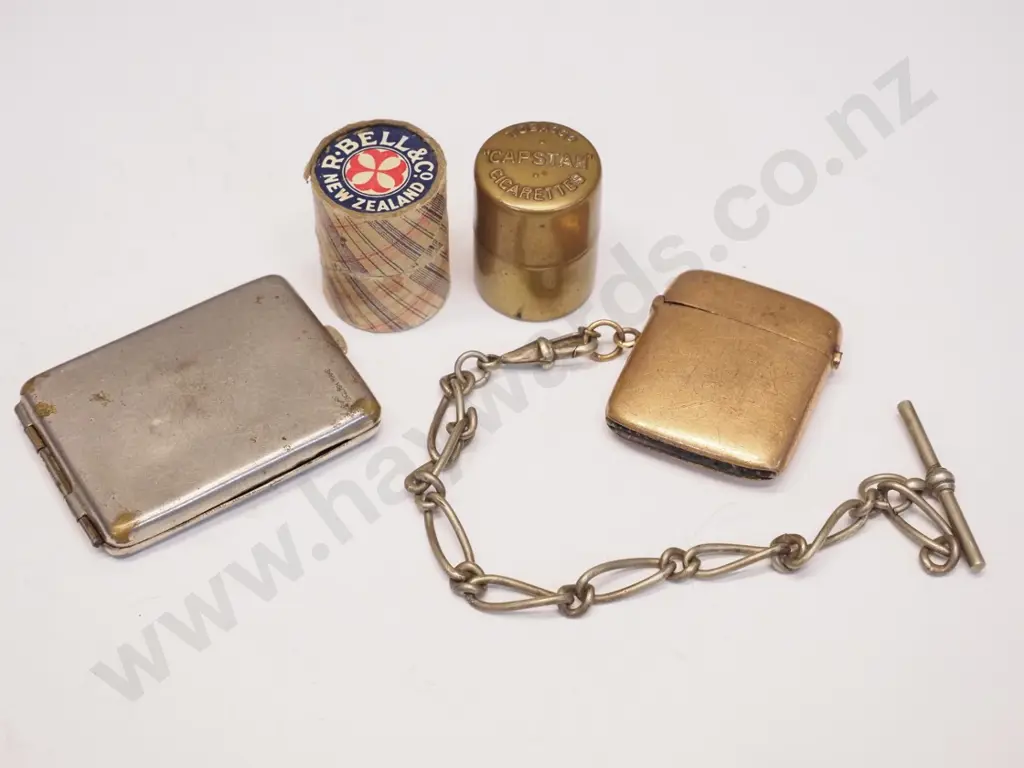 2 plated vesta cases 1 with part chain & 2 round box vesta holders 1 with 'Capstan' plated, & 1 R.Bell Co NZ Image 1++