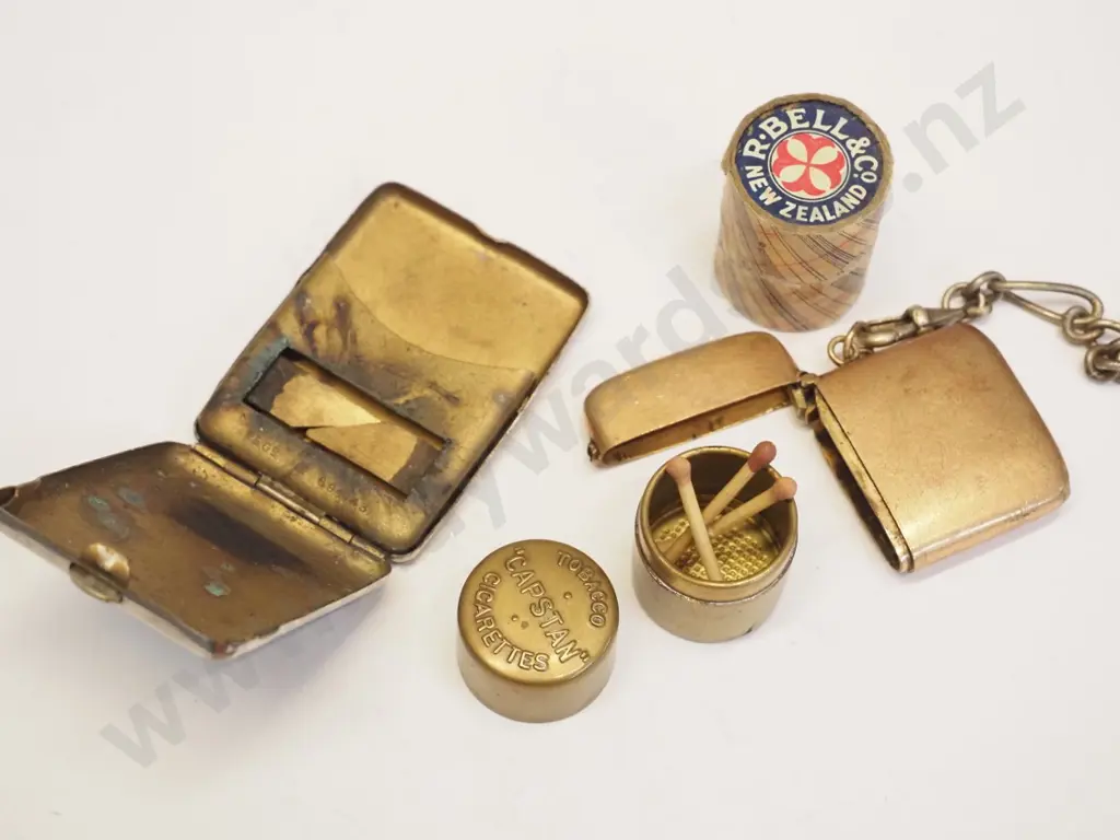 2 plated vesta cases 1 with part chain & 2 round box vesta holders 1 with 'Capstan' plated, & 1 R.Bell Co NZ Image 1++