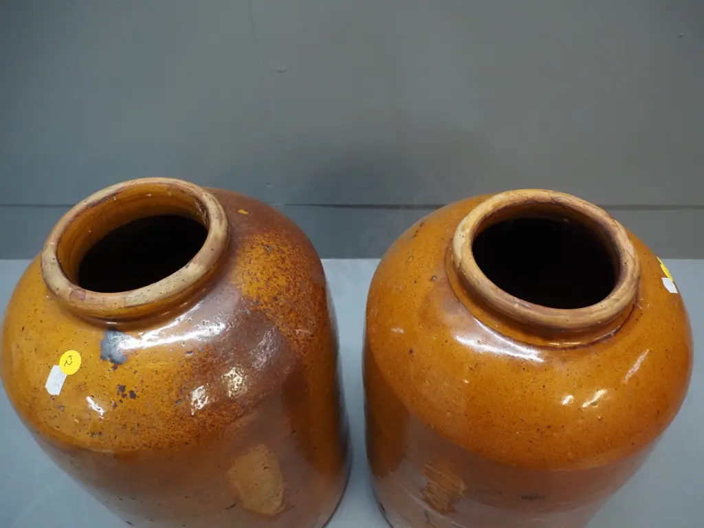 2 wide mouth stoneware crocks, one with wooden lid, both w/patching repairs around rim, one w/chip to base H-360 D-220 Image 1++
