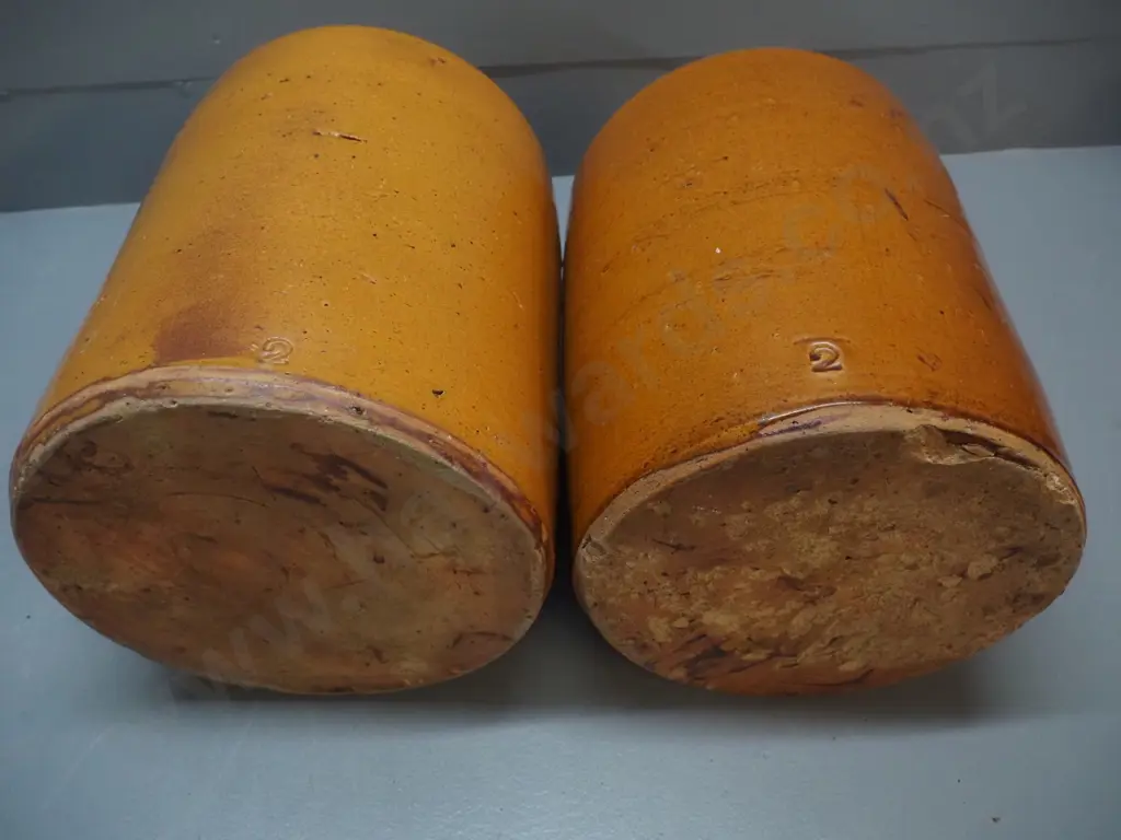 2 wide mouth stoneware crocks, one with wooden lid, both w/patching repairs around rim, one w/chip to base H-360 D-220 Image 1++