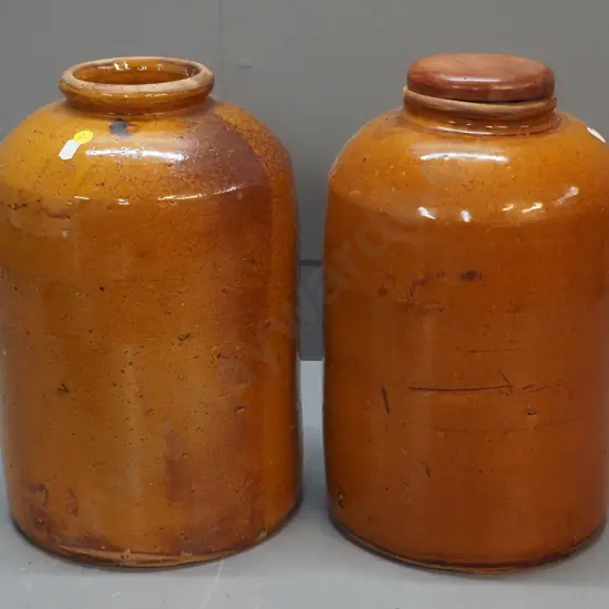 2 wide mouth stoneware crocks, one with wooden lid, both w/patching repairs around rim, one w/chip to base H-360 D-220