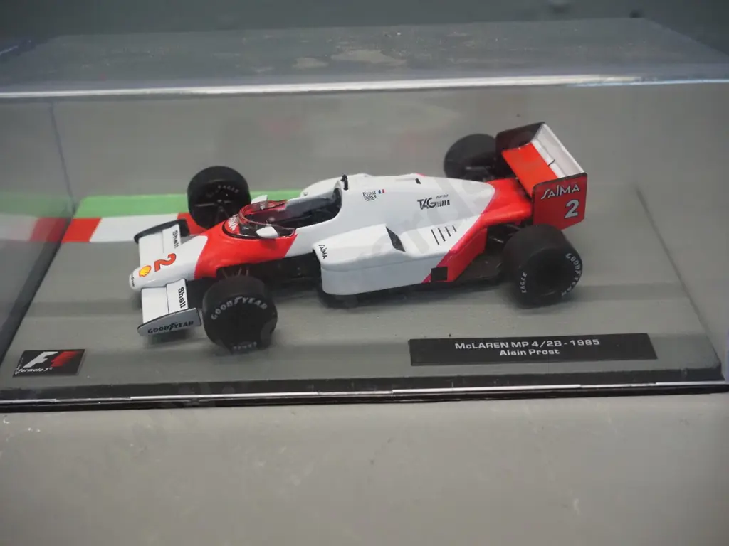3 die-cast 1:43 scale Formula 1 racing cars - 1984 and 1985 Ayrton Senna, 1985 Alain Prost Image 1++