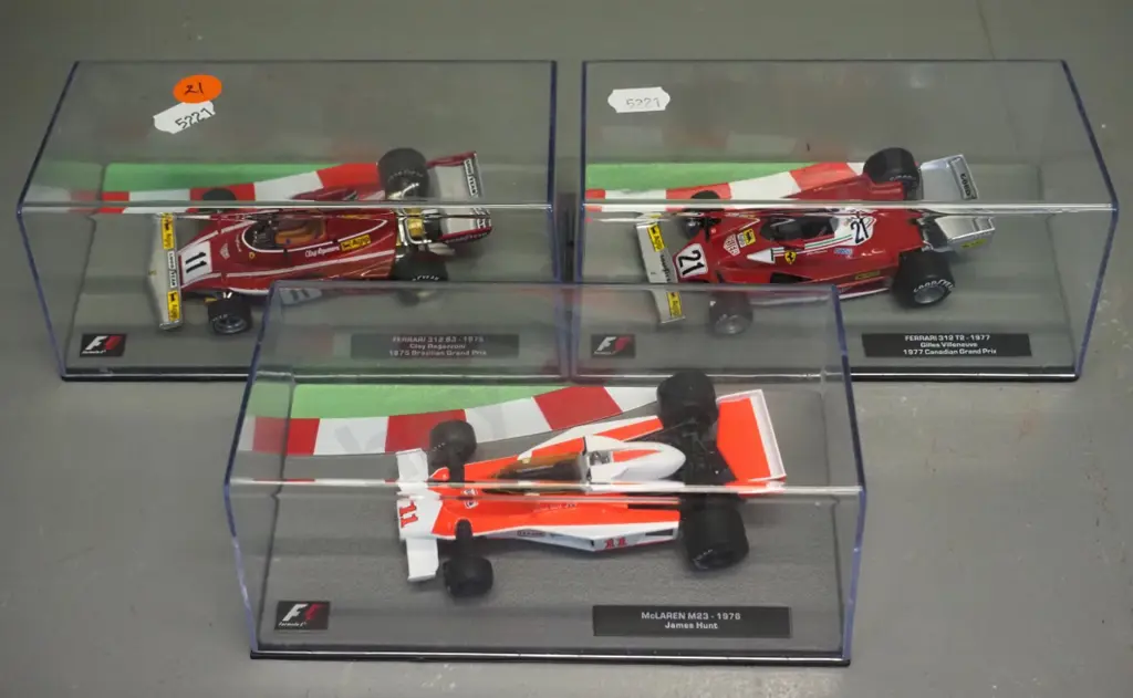 3 die-cast 1:43 scale Formula 1 racing cars - 1975 Clay Regazzoni, 1976 James Hunt, 1977 Villenueve Image 1++