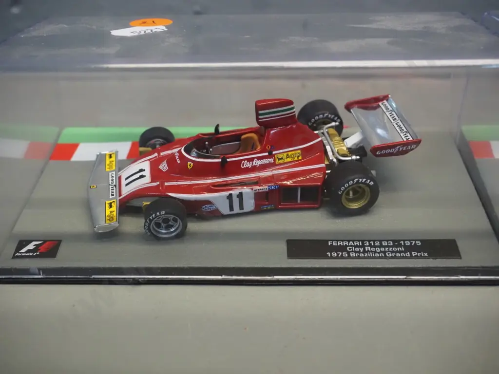 3 die-cast 1:43 scale Formula 1 racing cars - 1975 Clay Regazzoni, 1976 James Hunt, 1977 Villenueve Image 1++