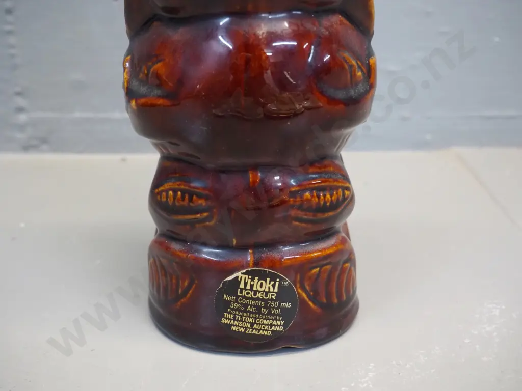 Titoki stoneware Maori tiki motif bottle, stamped 9914. H-300 Image 1++