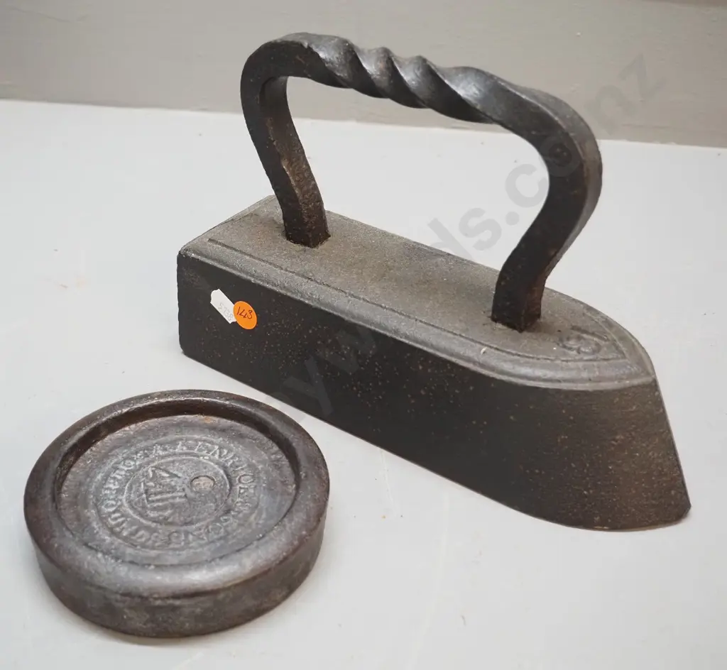 large heavy cast iron No. 18 sad iron with twist handle L-230 and a 4-lb. weight marked Kenrick & Sons Image 1++