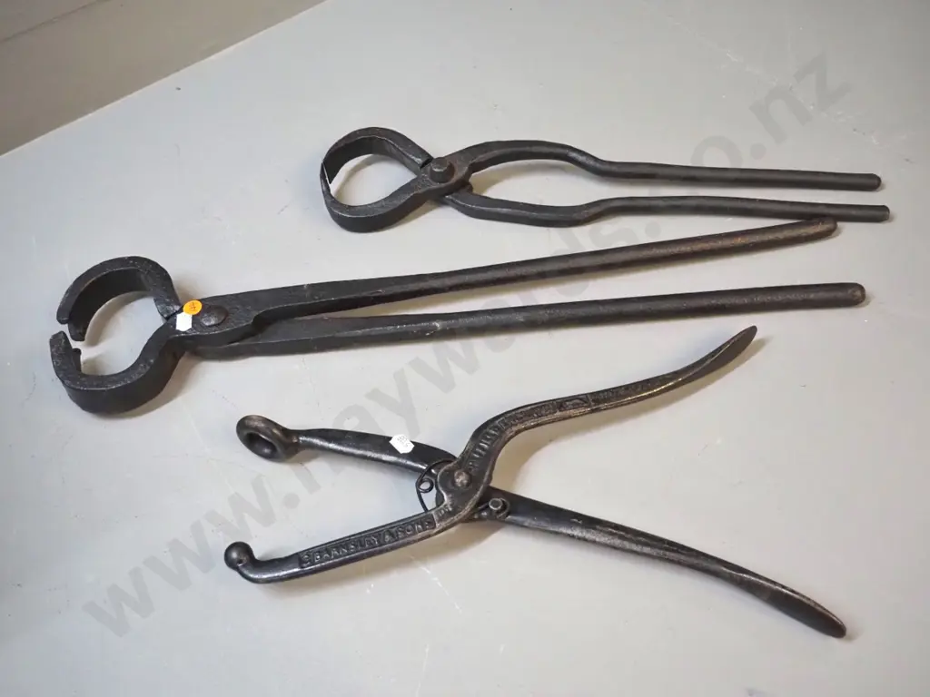 2 pairs cast iron blacksmith's tongs - larger is L-600, and spring-action pincer with ball end - leatherworking? Image 1++