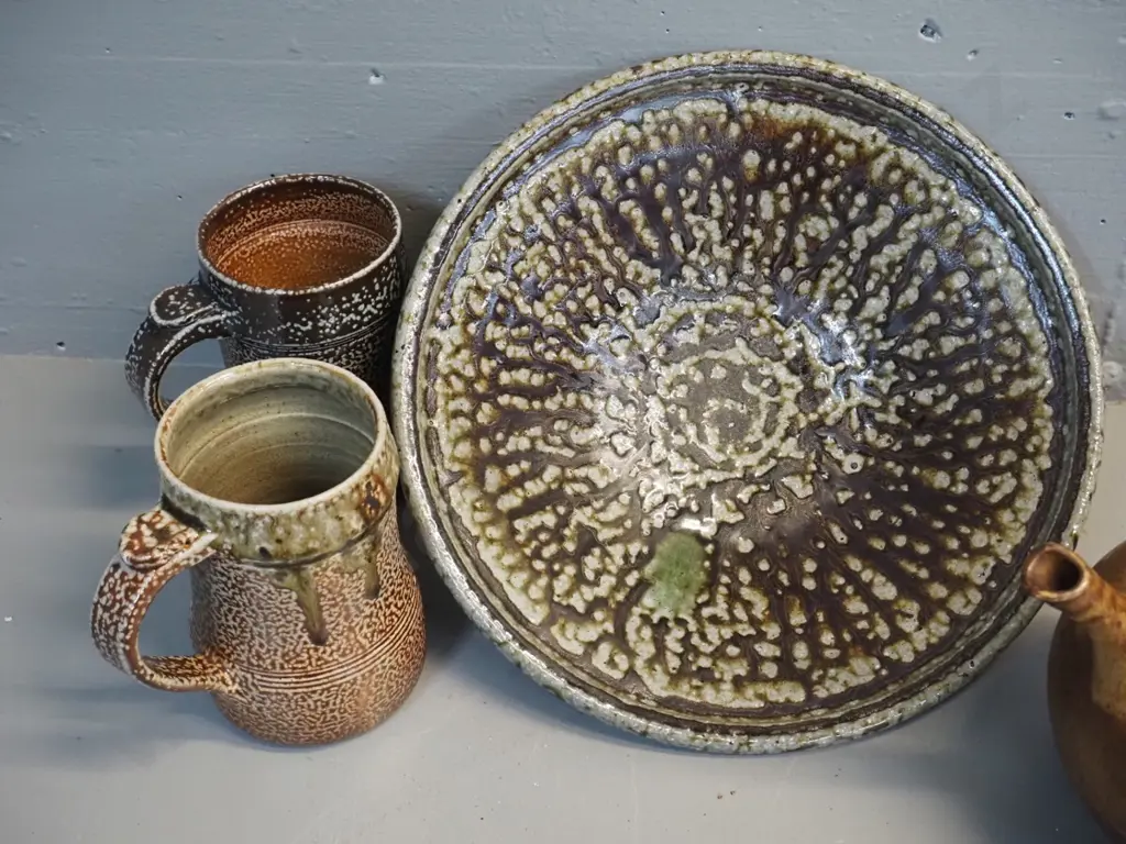 4 pieces studio pottery - 2 Danny Moorwood coffee mugs, teapot and bowl D285 with unknown marks - bowl has chips to base Image 1++