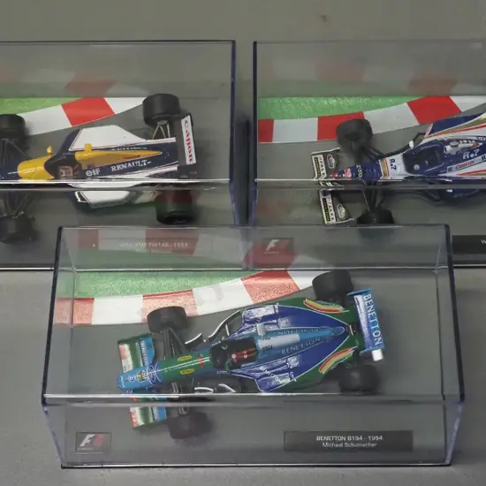 3 die-cast 1:43 scale Formula 1 racing cars - 1992 Nigel Mansell, 1994 Michael Schumacher, 1997 Jacques Villeneuve