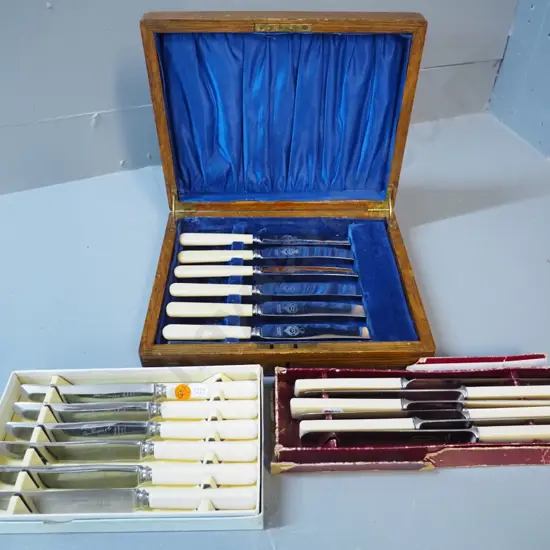 3 sets bone and/or faux bone handled knives, one in wooden box, one with square handles