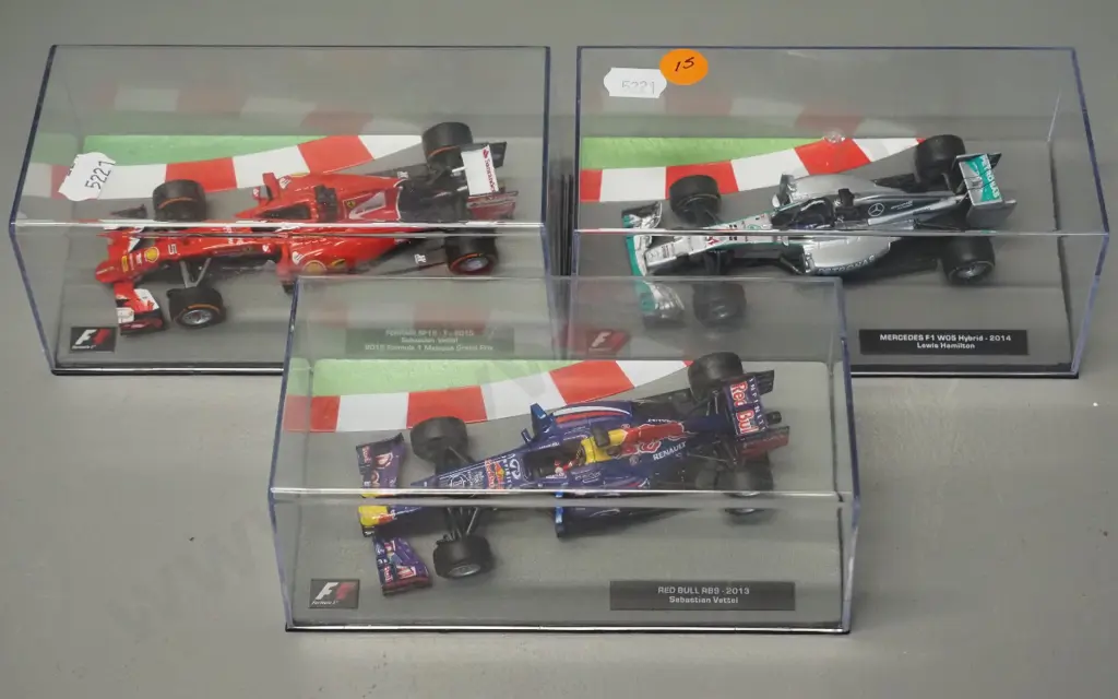 3 die-cast 1:43 scale Formula 1 racing cars - 2014 Lewis Hamilton, 2013 Sebastian Vettel, 2015 Sebastian Vettel Image 1++