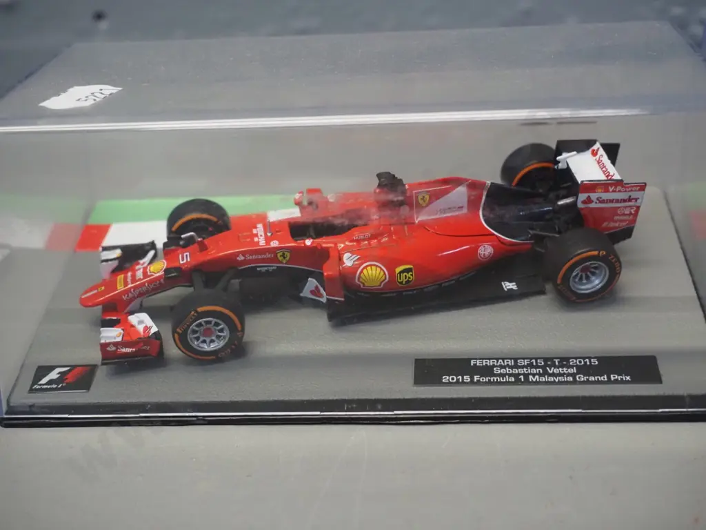 3 die-cast 1:43 scale Formula 1 racing cars - 2014 Lewis Hamilton, 2013 Sebastian Vettel, 2015 Sebastian Vettel Image 1++