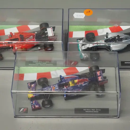 3 die-cast 1:43 scale Formula 1 racing cars - 2014 Lewis Hamilton, 2013 Sebastian Vettel, 2015 Sebastian Vettel