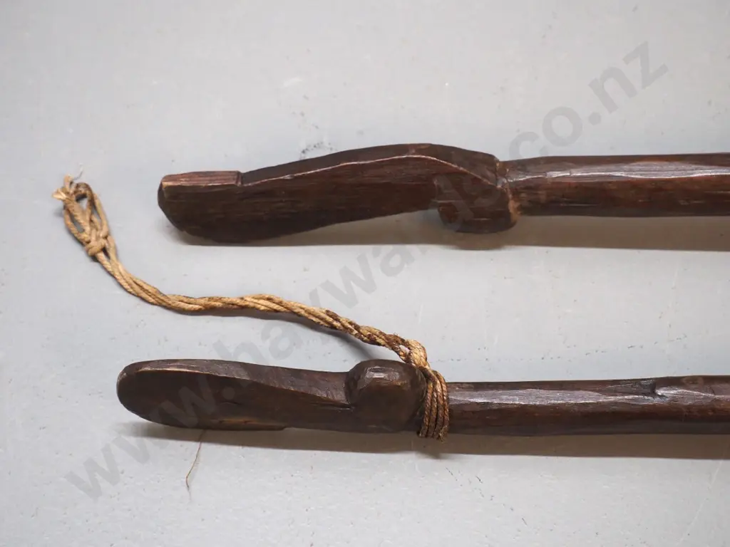 pair of vintage carved wooden paddles - longer one is L-1560, shorted one has cracks in handle Image 1++