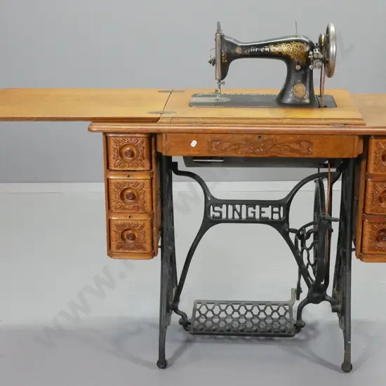 vintage Singer treadle sewing machine in 6-drawer oak case on cast iron base H770 W920 D460 closed