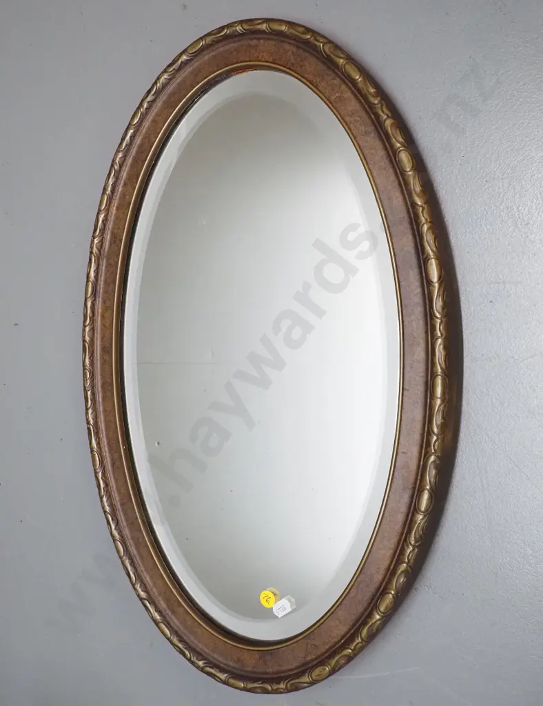 vintage oval bevelled edge wall mirror - frame has mottled gilt finish - small spots of desilvering H560 W355 Image 1++