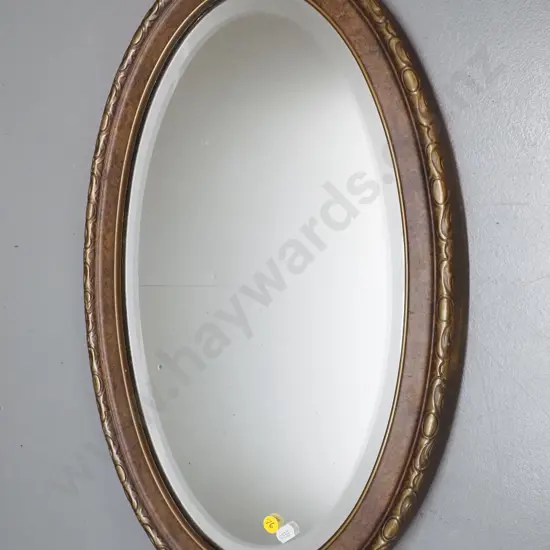 vintage oval bevelled edge wall mirror - frame has mottled gilt finish - small spots of desilvering H560 W355