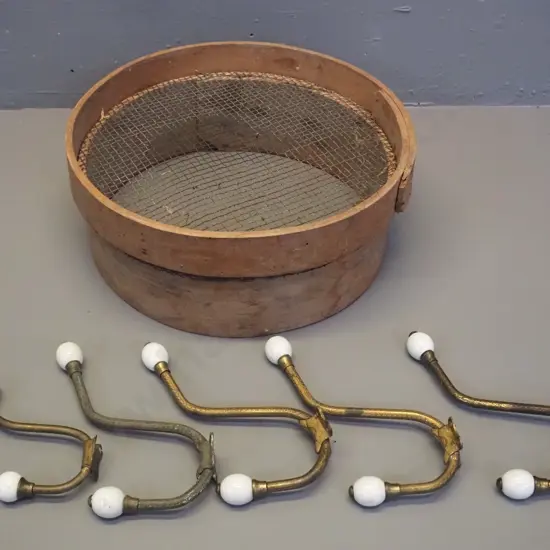 5 vintage metal coat hooks with porcelain knobs (one non matching) and a small garden sieve D-330