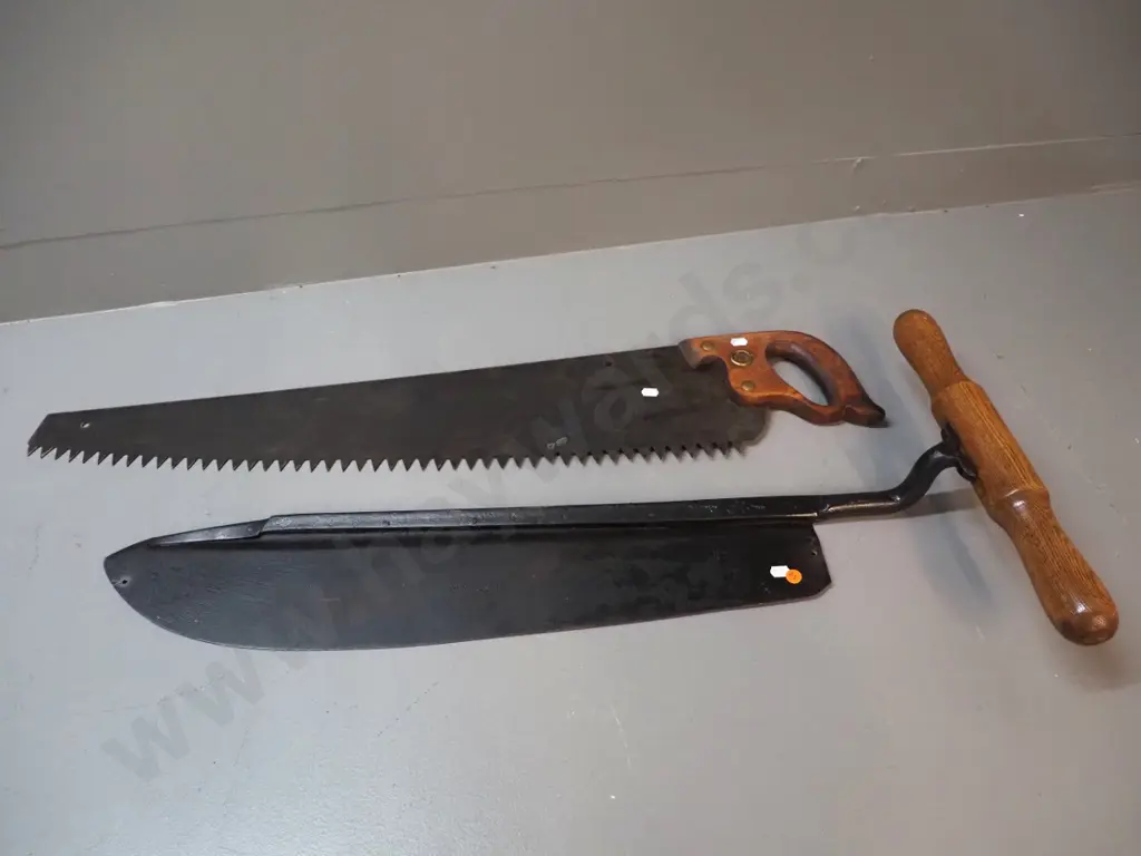 vintage saw marked Disston L-880 and a timber handled hay knife with Skelton & Co Sheffield mark Image 1++
