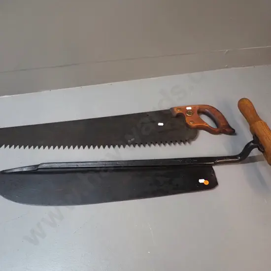 vintage saw marked Disston L-880 and a timber handled hay knife with Skelton & Co Sheffield mark