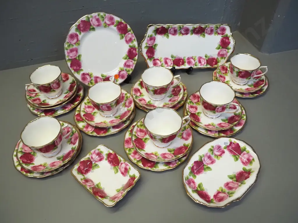 collection of Royal Albert Old English Rose tea ware including 7 trios, sandwich tray, small cake plate, etc. Image 1++