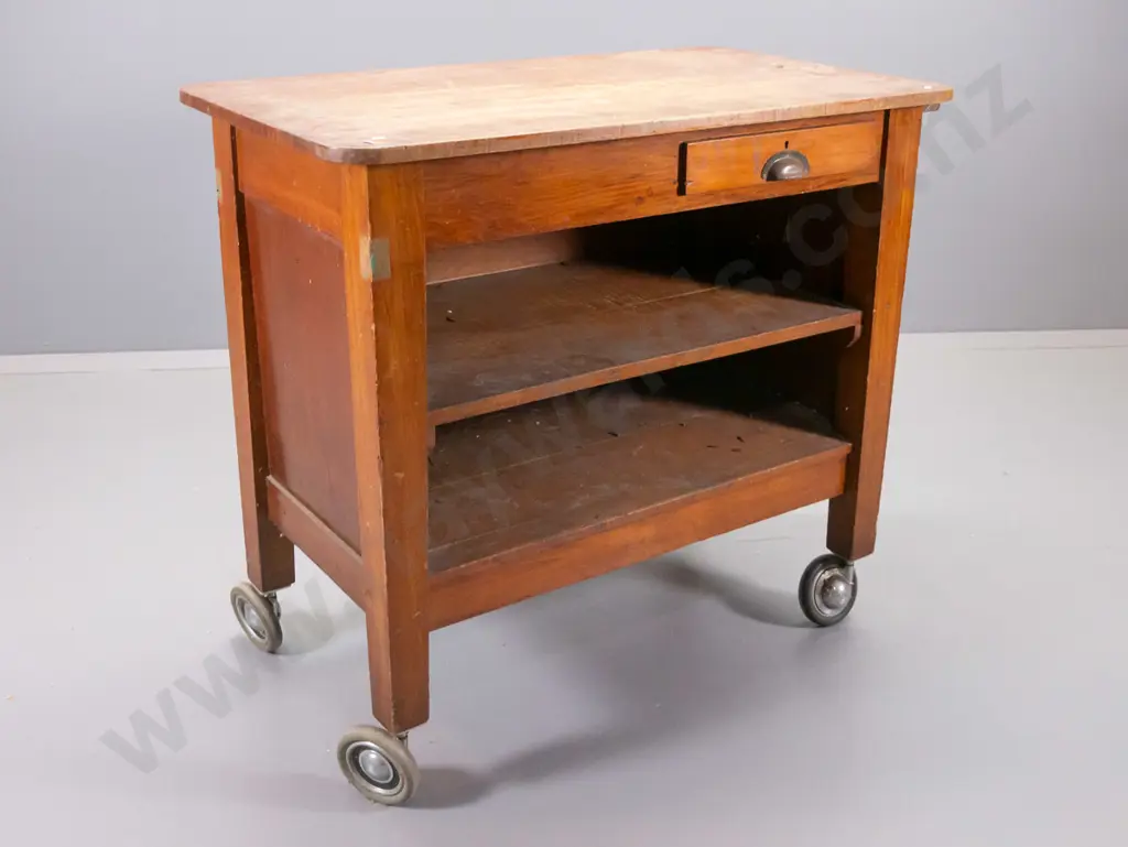 vintage kauri 2-drawer open-shelf work cabinet on large casters, ex chief post office, has some holes drilled, polish Image 1++