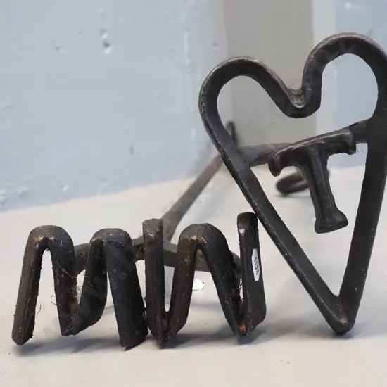 2 vintage hand-forged branding irons - WM and T inside a heart. WM is L-820