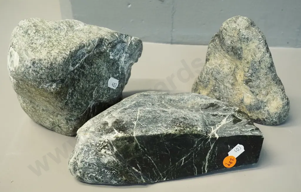 3 pieces of pounamu, each with one polished side, largest is H-120 L-160 Image 1++