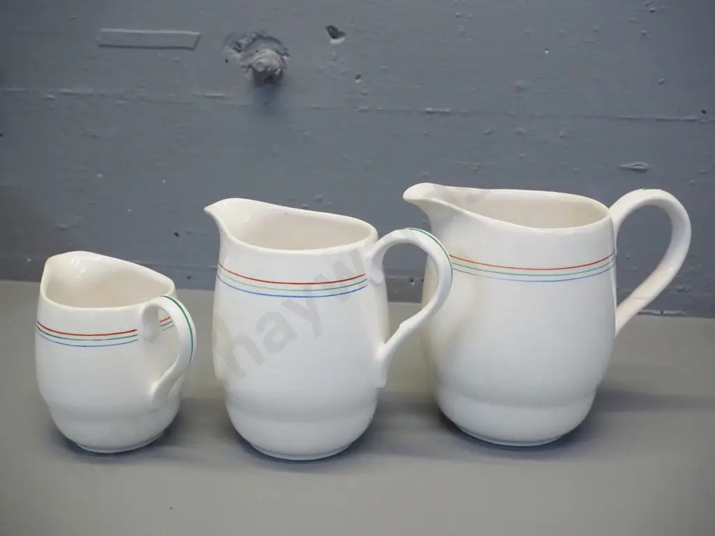 graduated set of 3 Crown Lynn jugs with multi-colour pinstripes - largest is H-160 Image 1++