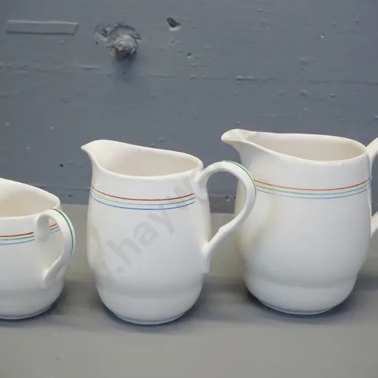 graduated set of 3 Crown Lynn jugs with multi-colour pinstripes - largest is H-160