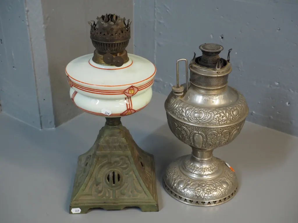 2 kerosene lamp bases, no chimneys - one pressed metal Miller USA and other art nouveau style glass on cast iron base Image 1++