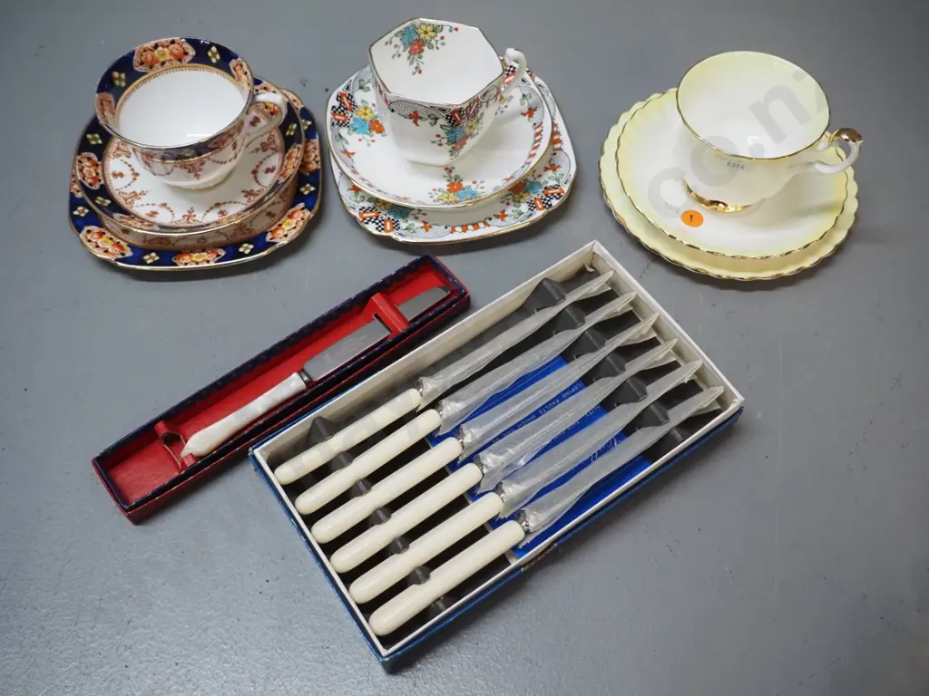 3 Royal Albert trios, boxed set of small bone-handled knives & a boxed small mother of pearl handled knife Image 1++