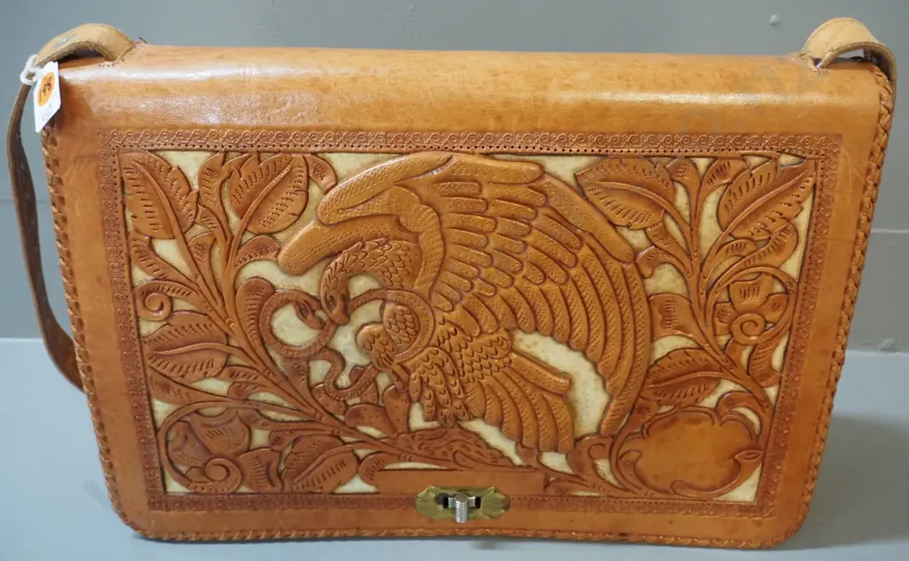 2 handbags - black cloth with shells & beads and hand-tooled (Mexican?) leather w/eagle and Aztec or Mayan motifs Image 1++