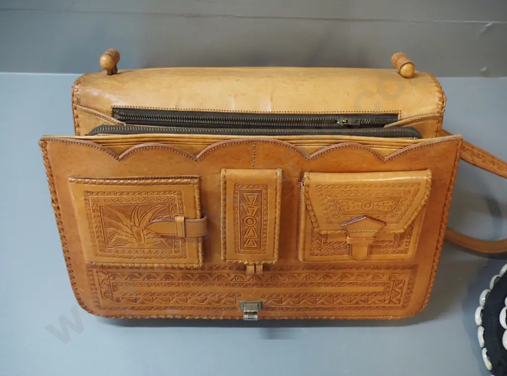 2 handbags - black cloth with shells & beads and hand-tooled (Mexican?) leather w/eagle and Aztec or Mayan motifs Image 1++