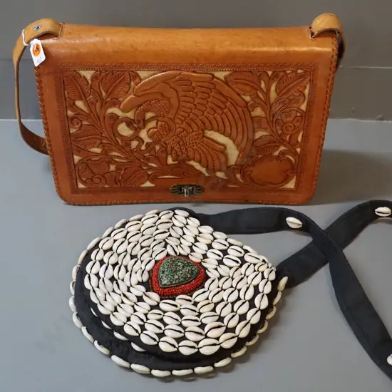 2 handbags - black cloth with shells & beads and hand-tooled (Mexican?) leather w/eagle and Aztec or Mayan motifs