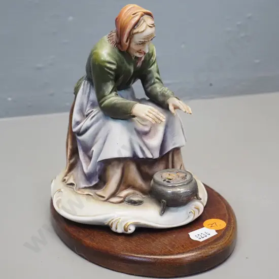 Italian porcelain figurine on wooden stand - woman warming her hands. Signed & marked A. Borsato Milan H155
