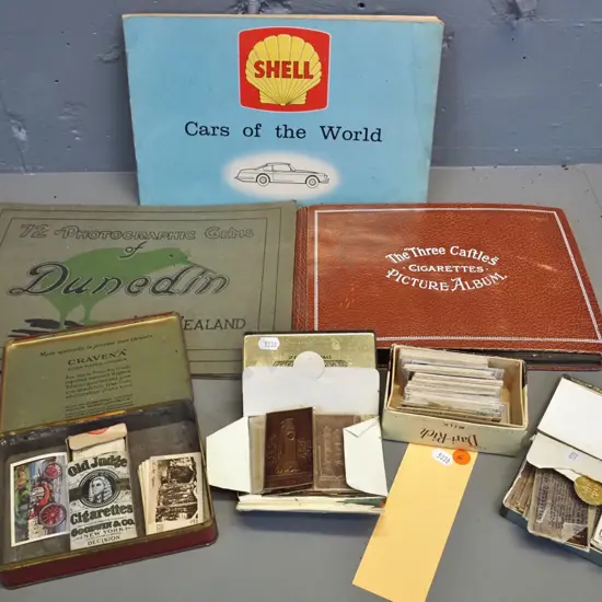 3 Castles cigarette card album, assorted loose cards in tobacco tins, Shell Cars of the World album and Dunedin