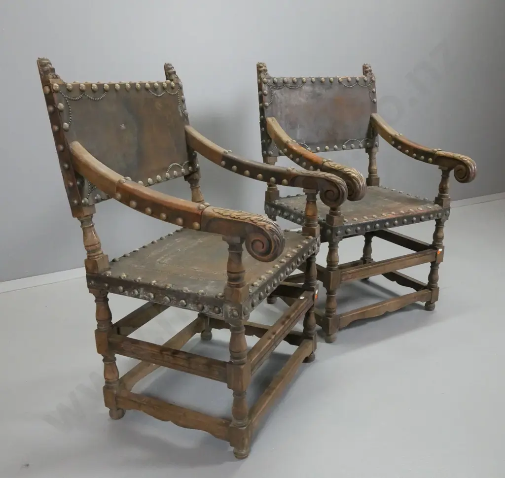 pair of vintage oak Tudor style chair armchairs w/ large brass-studded leather seat, back and arm caps H985 W580 D600 Image 1++