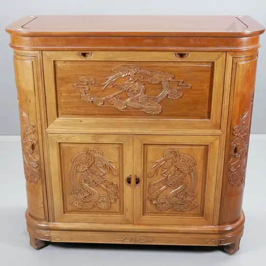 reproduction asian mahogany drinks cabinet w/ dragon motif carving, lift top, internal sliding bottle tray & drawer,