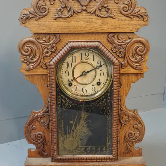 vintage mantel clock in heavily carved oak case, no maker's marks, discolouration to dial and brass bezel H585 W395 D125