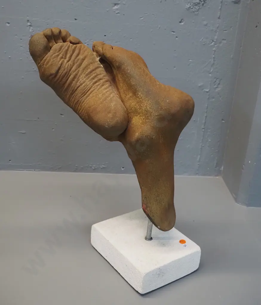 composite foot sculpture with faux oxidised metal finish on white stone base - finish has had some touch-ups H-470 Image 1++