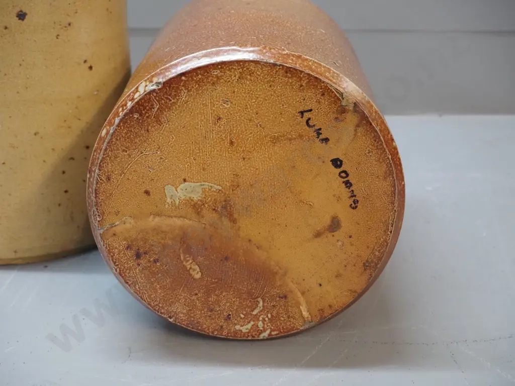 2 narrow-mouth salt-glazed crocks, one marked Luke Adams H310, other has wire handle Image 1++