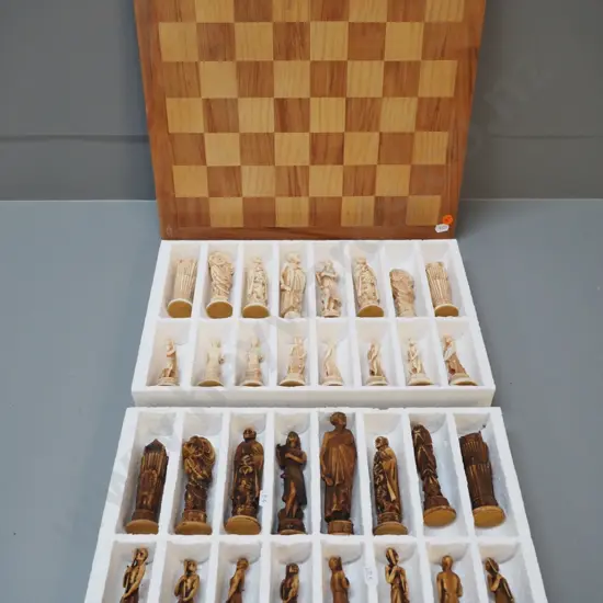 chess set with composite Maori themed pieces, tallest H120, a few scratches to wooden board