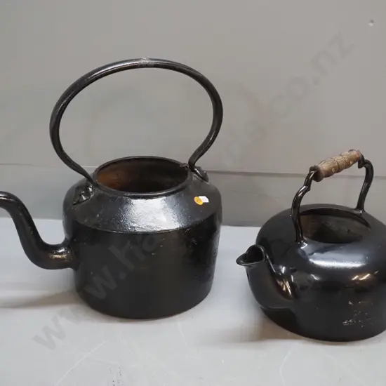 2 kettles painted black - no lids. Smaller (Stensons?) made in New Zealand, other Kenrick  No 6 H370 D250