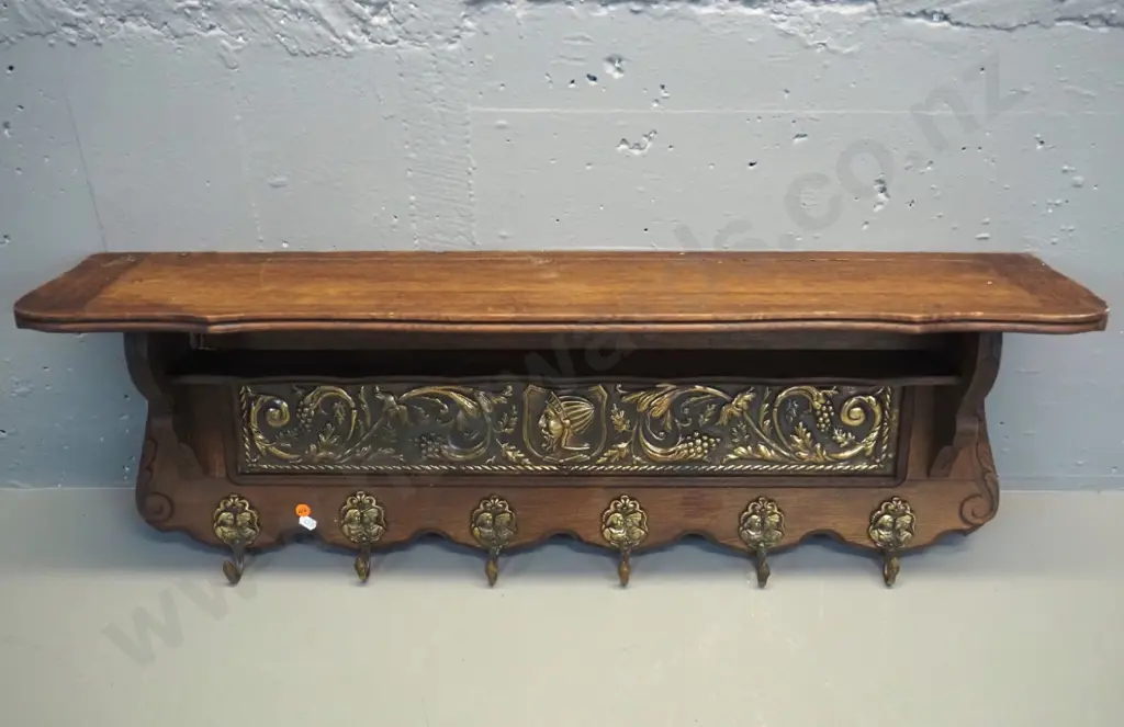 oak wall shelf with pressed brass panel, small lower shelf, and figural cast brass coat hooks H-350 W-850 D-200 Image 1++