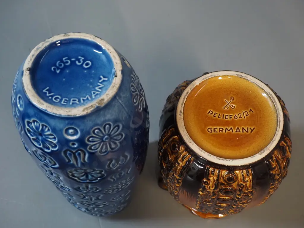 2 high-glaze German pottery vases - brown one marked Relief 62-21, blue one is H-310 Image 1++