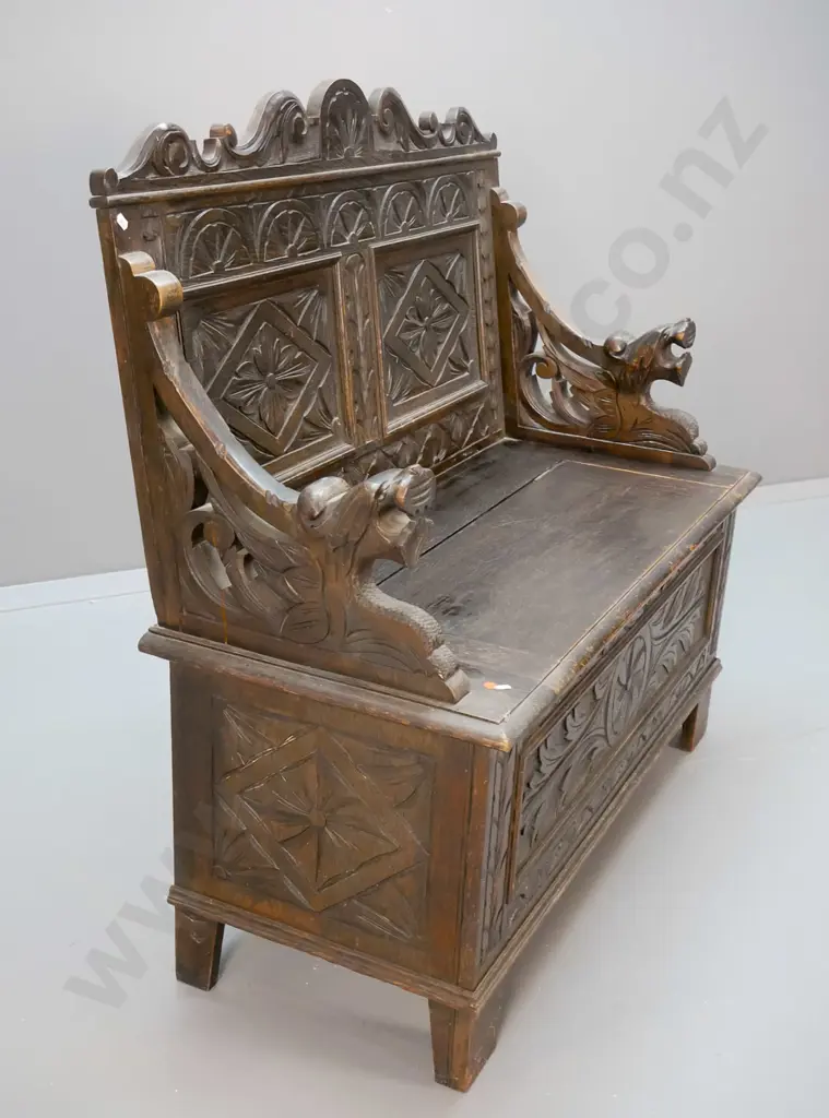 antique oak settle with lift-up seat, ornately carved front, back and arms H-1060 W-1060 D-460 Image 1++