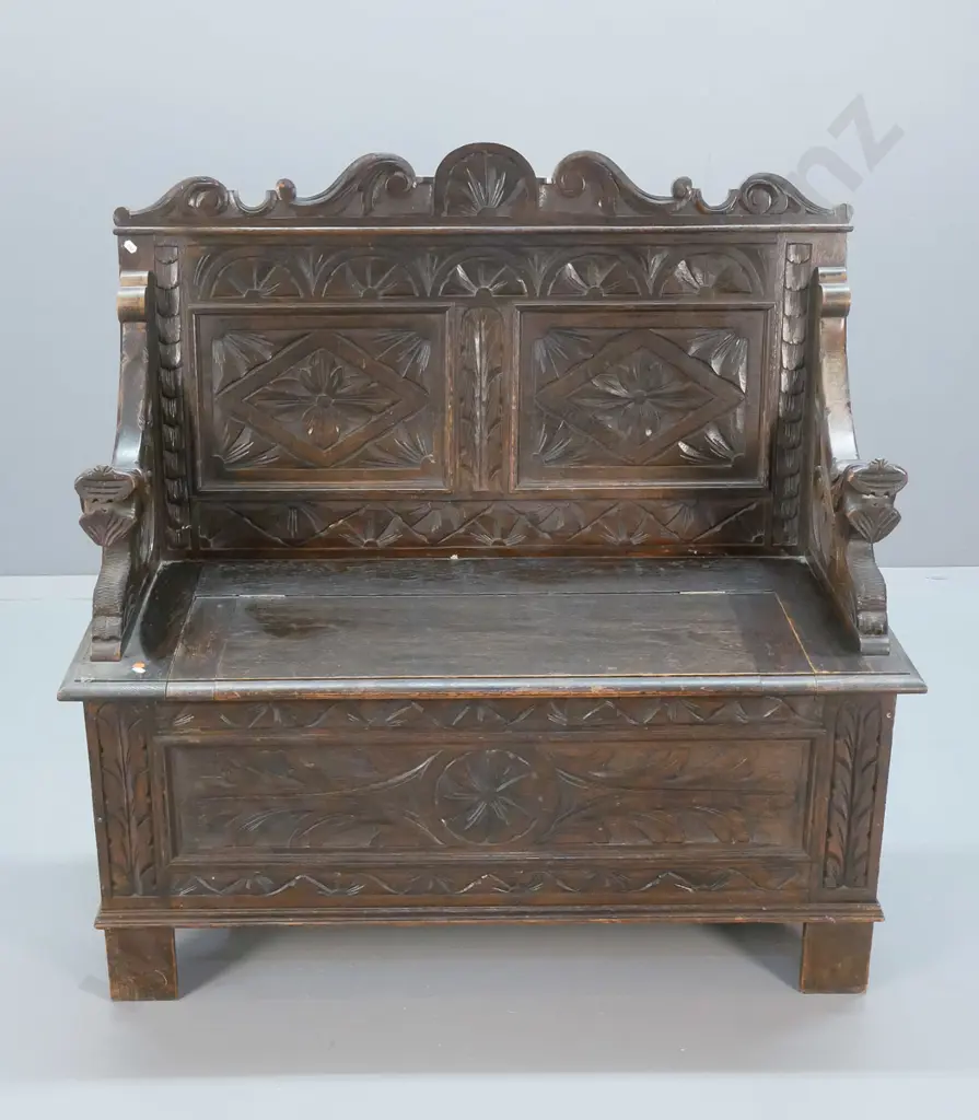 antique oak settle with lift-up seat, ornately carved front, back and arms H-1060 W-1060 D-460 Image 1++