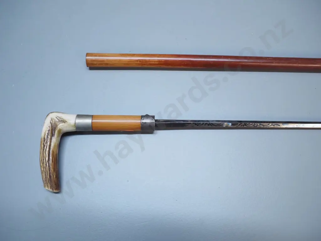 walking stick with horn handle, monogrammed nickel collar, and decorated steel pull-out blade L-860 Image 1++