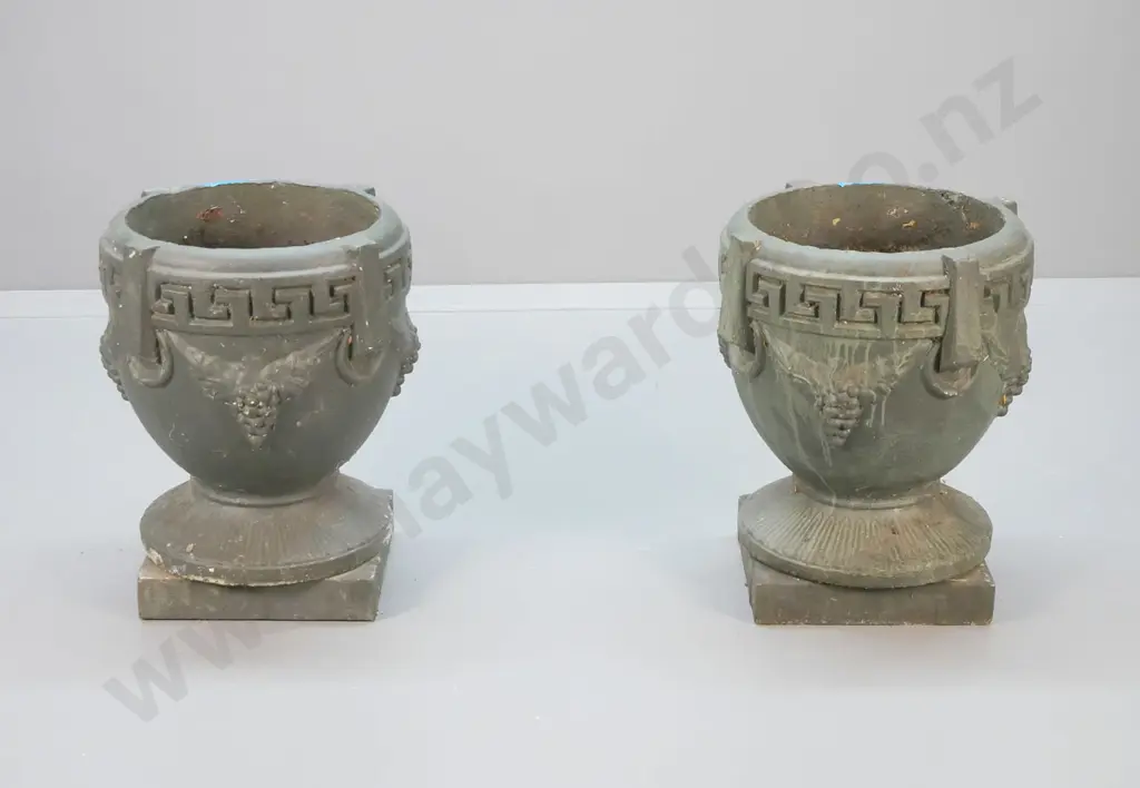 pair of classical style grape pattern green painted cast concrete garden urns on separate square bases. Minor chips H500 Image 1++